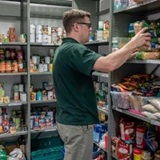 a person standing in front of a store
