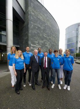 a group of people standing in front of a building