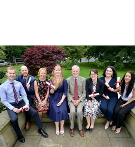 a group of people posing for the camera