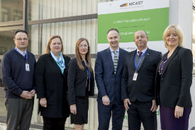 a group of people posing for the camera