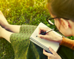 a person sitting on the grass