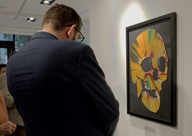 a man standing in front of a television