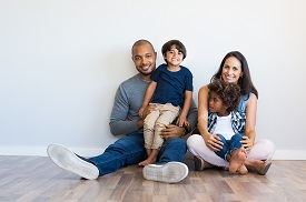 a group of people sitting on a bed