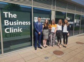 a group of people standing in front of a building