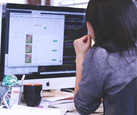 a person looking at a computer