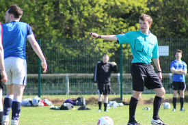a group of people playing football on a field