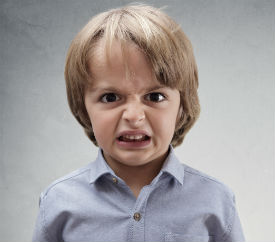 a young child smiling at the camera
