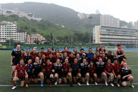 a group of people standing in front of a crowd