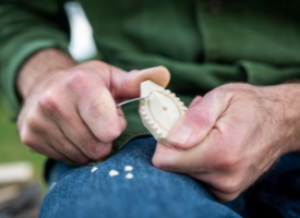 Philip Luscombe preparing artwork for the Wood of the Well exhibition at Chesters Roman Fort.