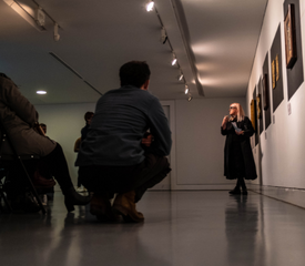 Claire A Baker introduces The Red Thread exhibition. Image credit, Craig McCann McMillan.