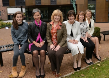 a group of people posing for the camera