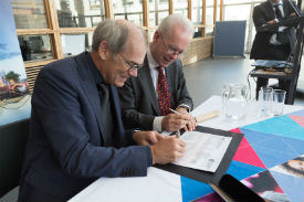 a man cutting a piece of paper