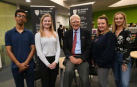 a group of people posing for the camera