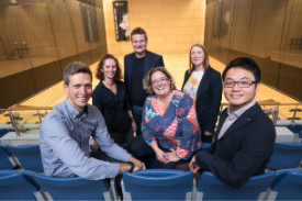 a group of people posing for the camera