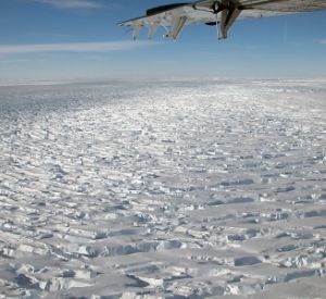 a plane flying over a body of water