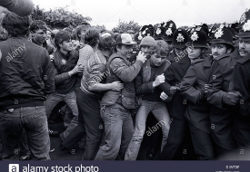 a group of people standing in front of a crowd posing for the camera