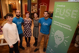 a group of people posing for the camera