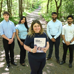 Clara May Warden (centre), founder of Dandelion Confidence, engages in fun forest activities with students from Northumbria University Business Clinic.