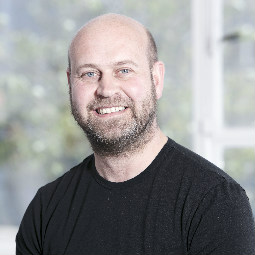 a man standing in front of a building