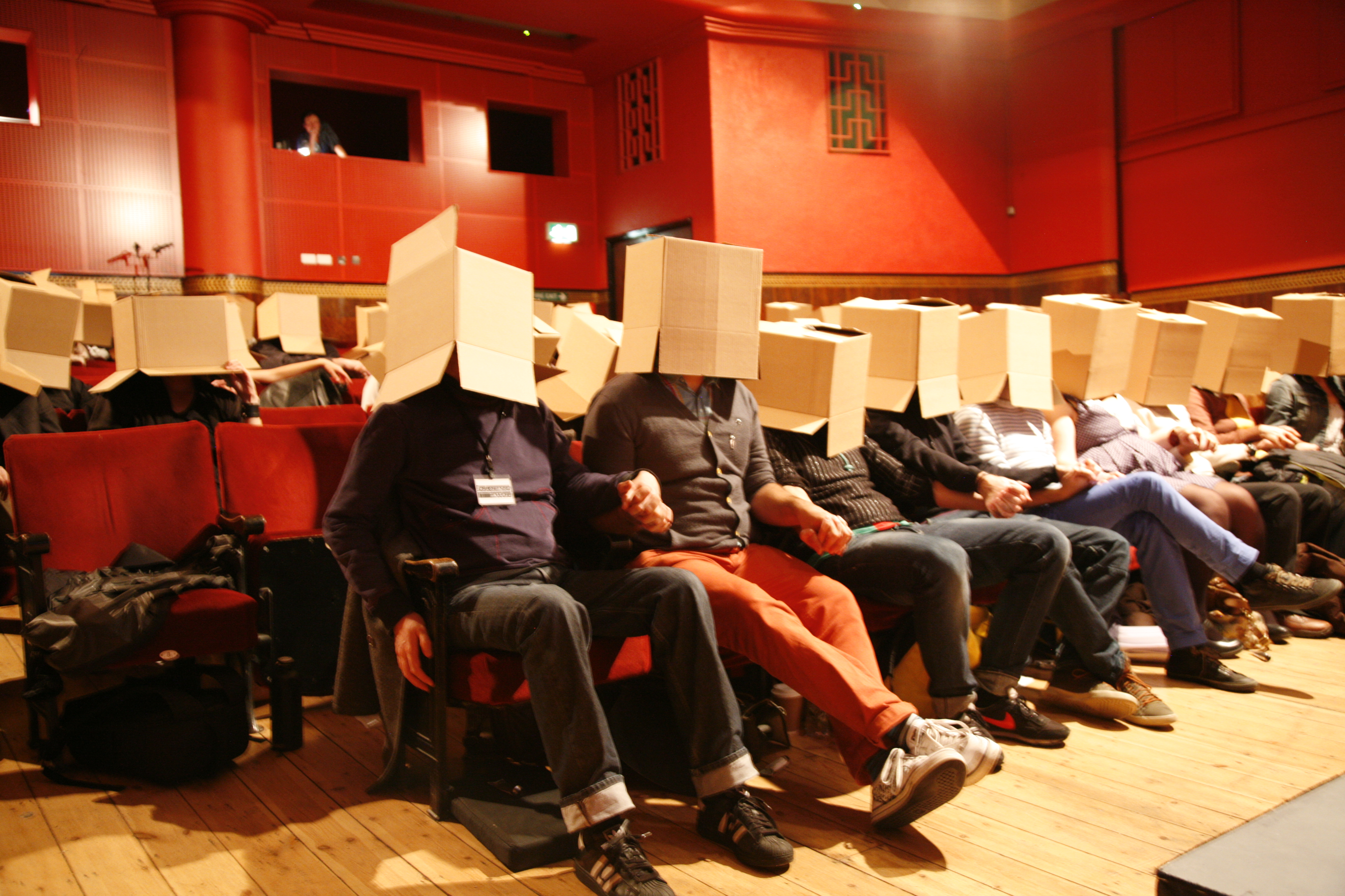 a group of people sitting around a living room