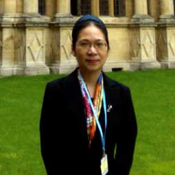 a person that is standing in the grass