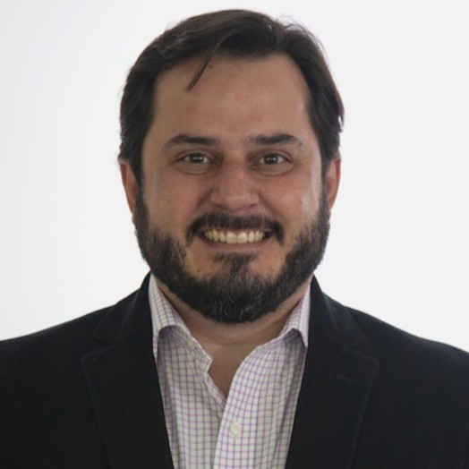 bearded man smiling at the camera