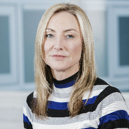 Kate White wearing a blue shirt