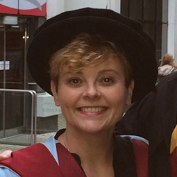 a woman smiling for the camera