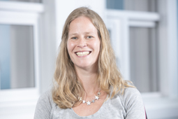 a woman smiling for the camera