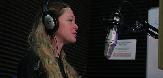 person speaking into microphone