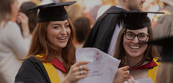 smiling students at graduation