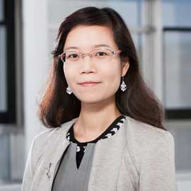 a woman standing in front of a building