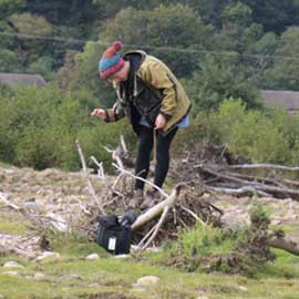 a man flying through the air on a dirt road