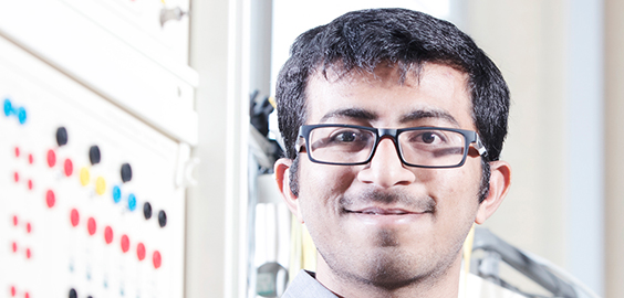 a man wearing glasses and looking at the camera