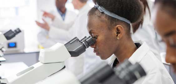 a man standing in front of a computer