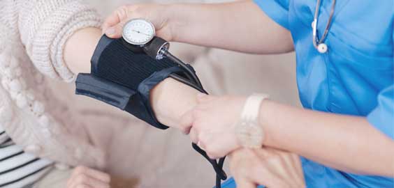 a hand holding a remote control