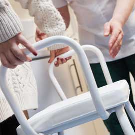 a woman holding a baby