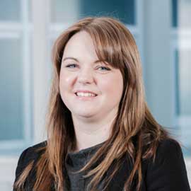 a woman smiling for the camera