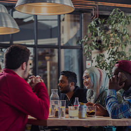 Group of students sat talking