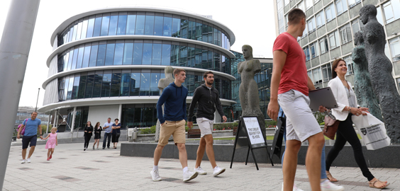 a group of people standing in front of a building