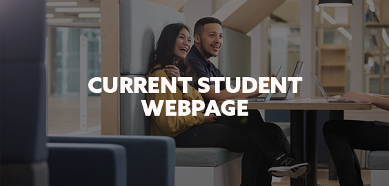 two students sitting at a table in Student Central