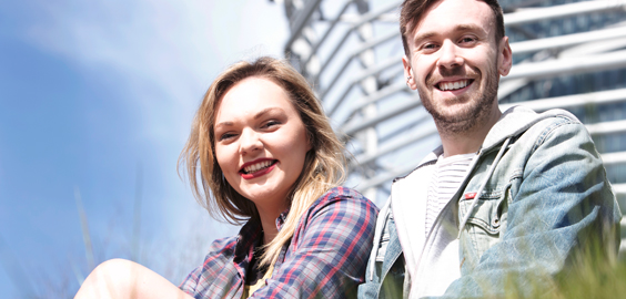 a man and a woman smiling for the camera
