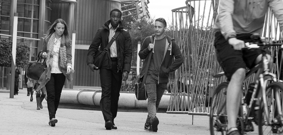 a group of people on a sidewalk