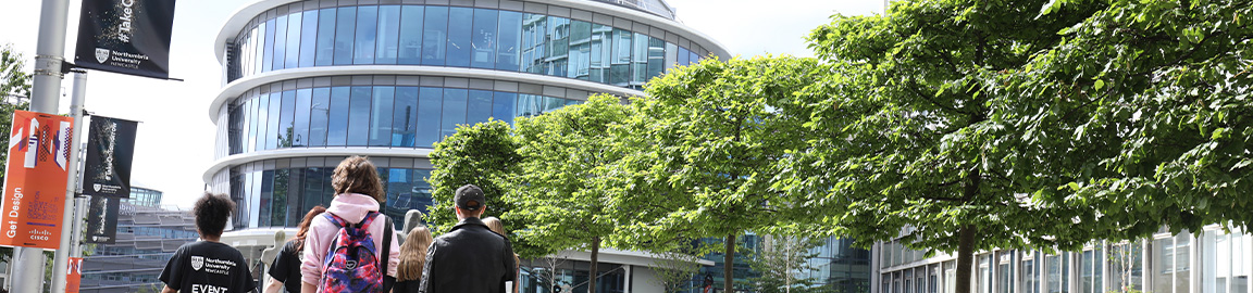 Group of students walking through campus
