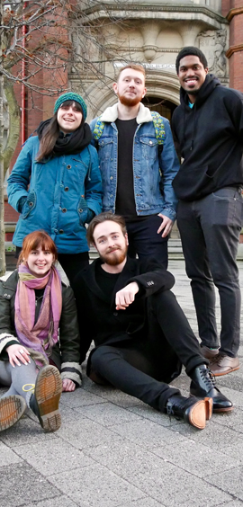 a group of people posing for the camera