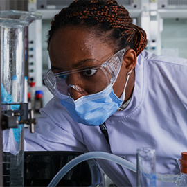 female student in lab coat 