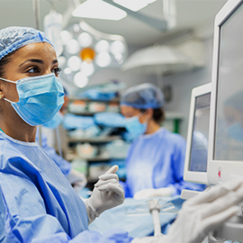 nurse checking monitor