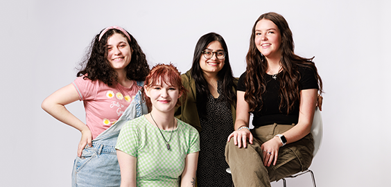 Image of four students smiling