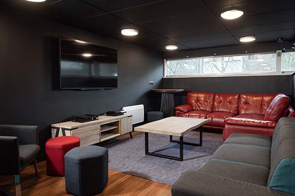 a living room filled with furniture and a large window