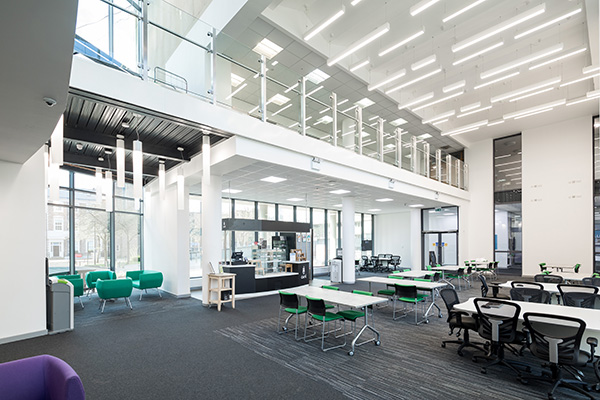 a room filled with furniture and a large building